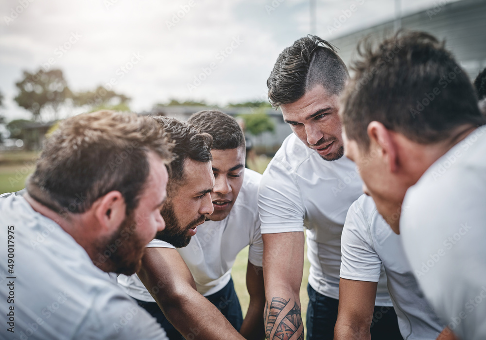 We got this boys. Cropped shot of a focused young rugby team forming a huddle before a match outside