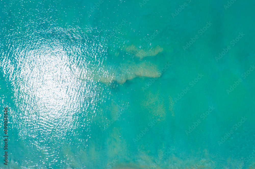 Sea surface aerial view,Bird eye view photo of small waves and water surface texture Turquoise sea b