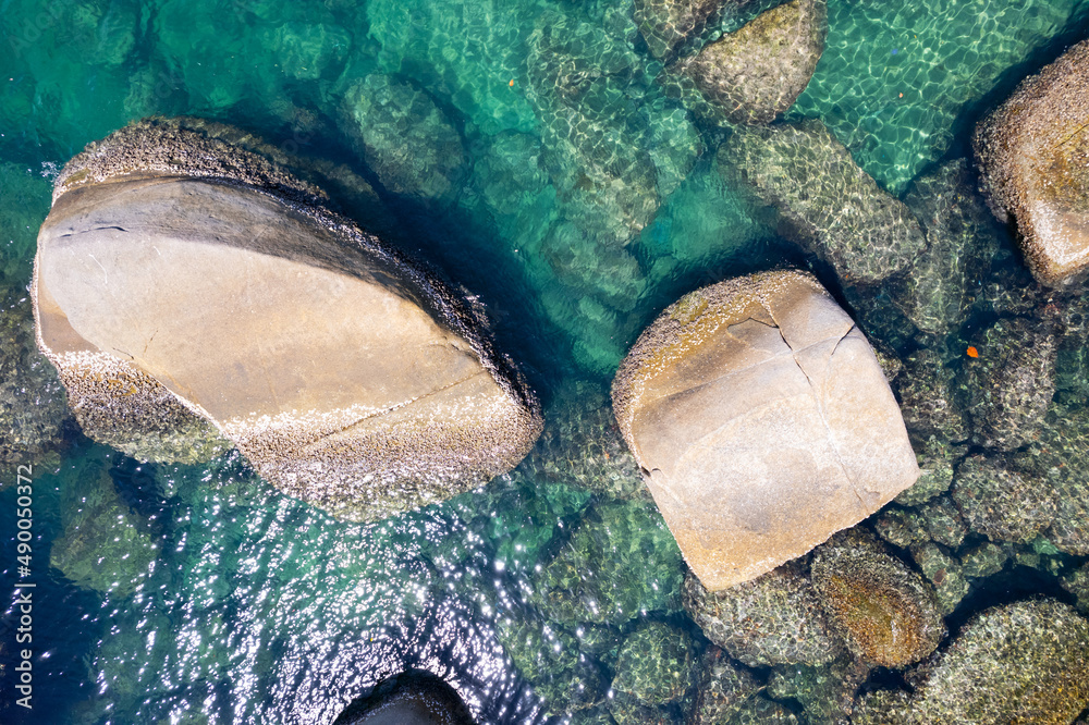 Aerial view Top down seashore rocks sea surface in sunny day Good weather day summer background