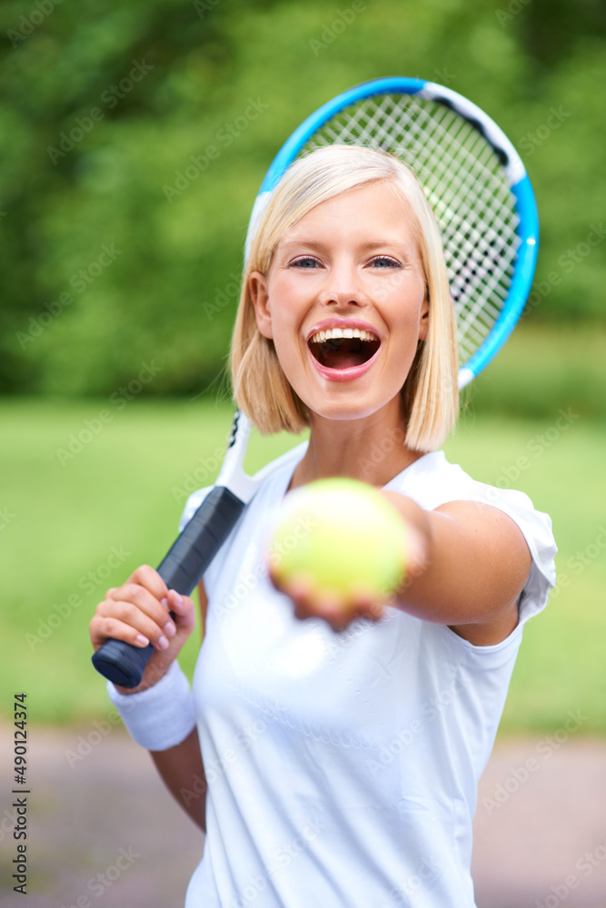 I dont want it. You take it. Portrait of a young female tennis player holding her racquet and offeri