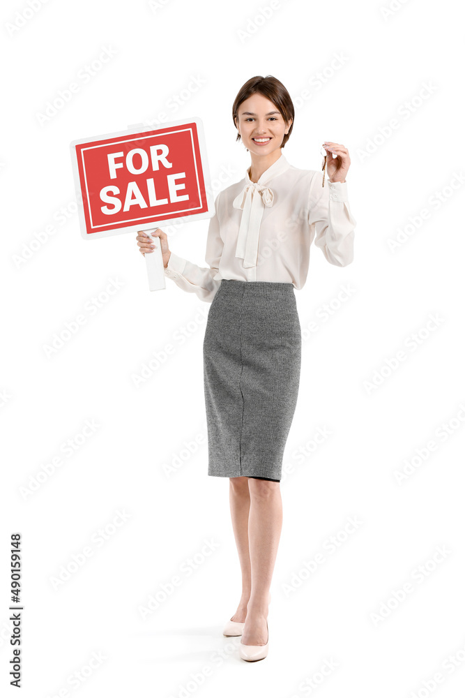 Female real estate agent with For Sale