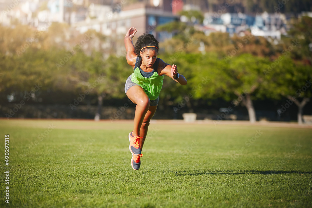 Sprint to the finish line of your goals. Shot of a sporty young woman exercising outdoors.