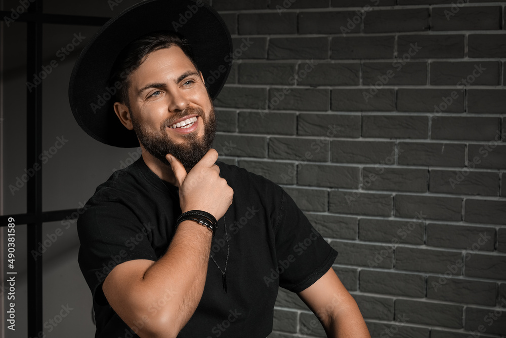 Stylish bearded man on dark background