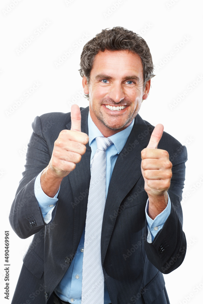 Mature executive giving thumbs up. Portrait of handsome business man giving thumbs up against white 