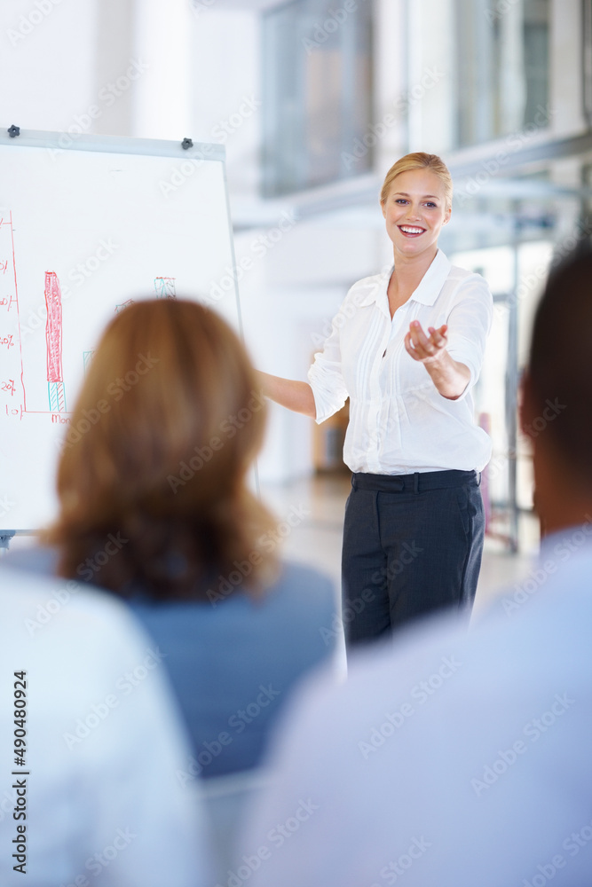 Business woman giving presentation to group. Portrait of beautiful business woman giving presentatio