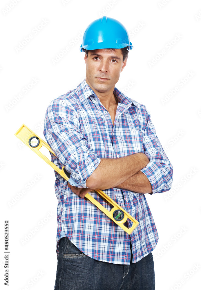 Young handyman with a spirit level against white background. Portrait of young handyman with a spiri