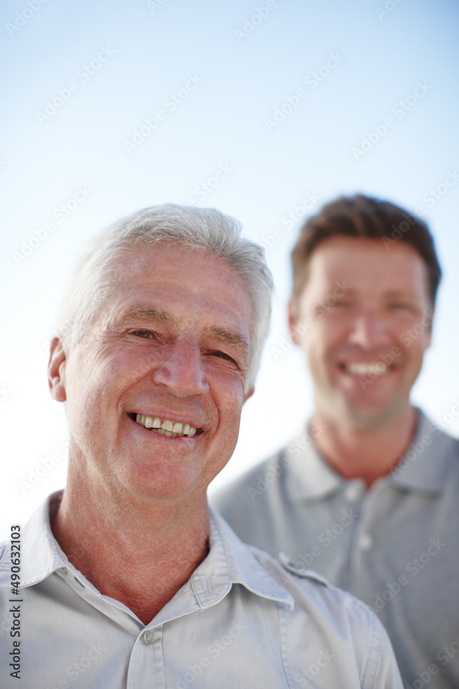 My son grew into a man. Cropped portrait of a mature man and his senior father standing outside.