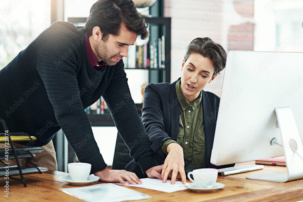 This is what we need to focus on now. Cropped shot of two businesspeople discussing work at a desk i