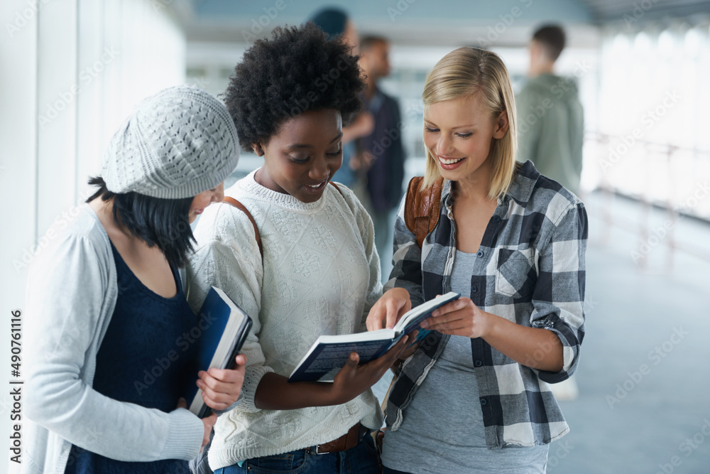 I remembered this section.... A group of college students looking at a book together.