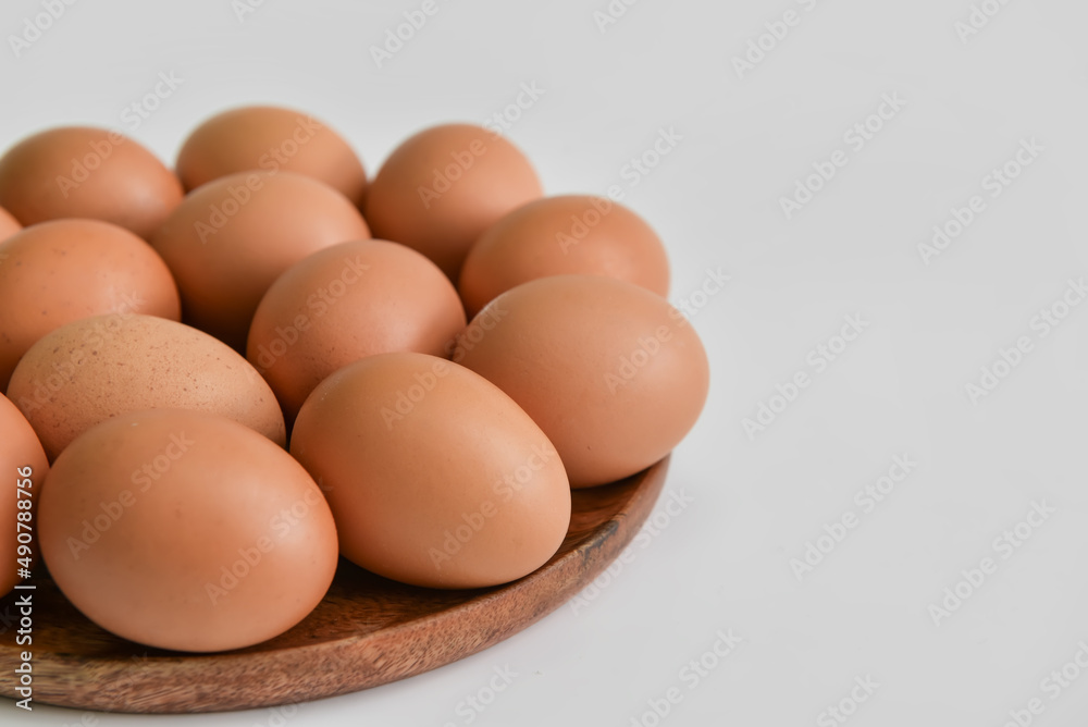 Plate with fresh chicken eggs on light background, closeup