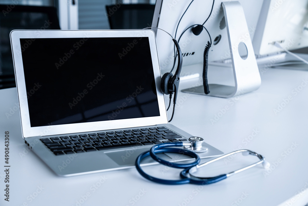 Headset and doctor equipment at clinic ready for actively support for patient by online video call .