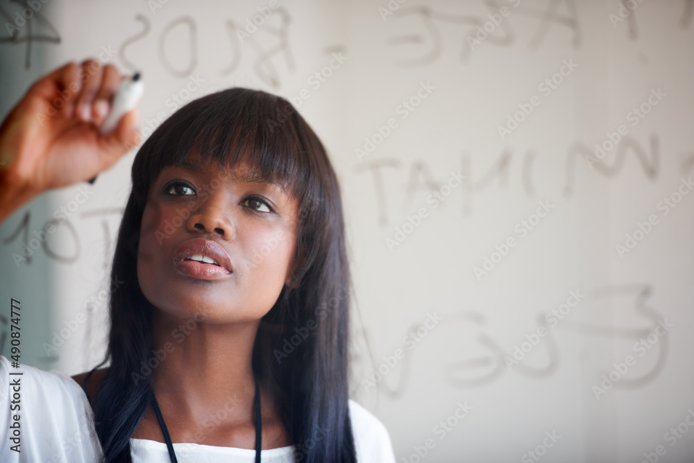 Planning it all out before starting. Cropped shot of a businesswoman doing planning on a glass wall.