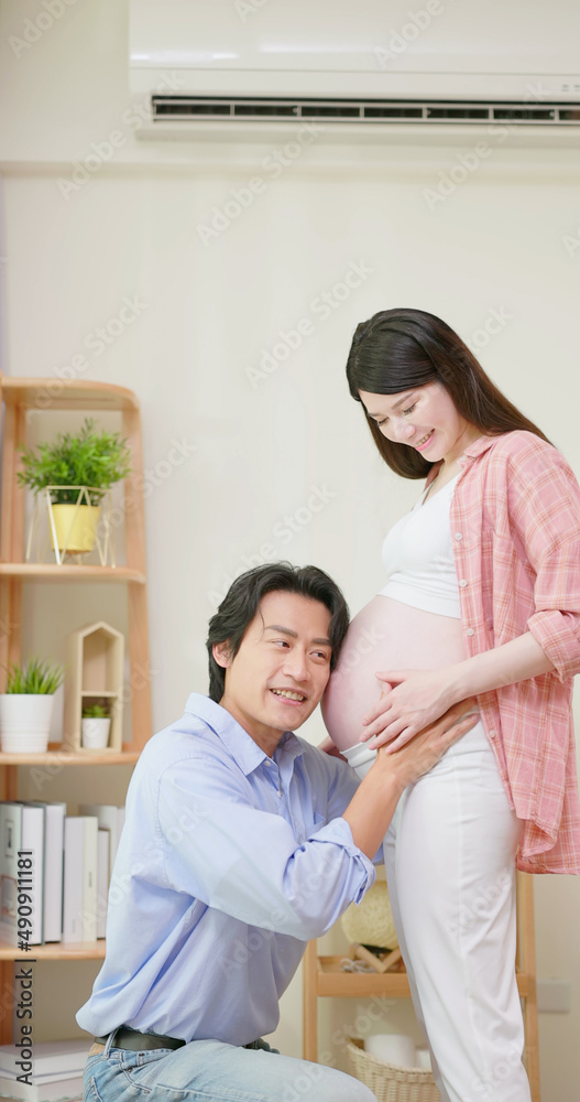 asian pregnant couple feel love