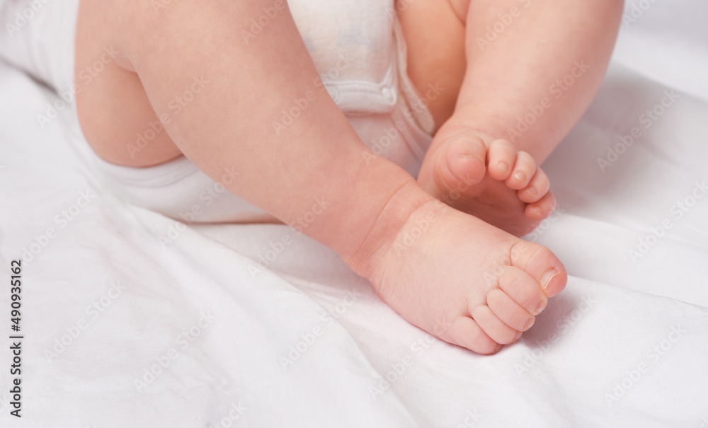 These feet will walk into the future. Cropped shot of a baby boys legs and feet in a studio.