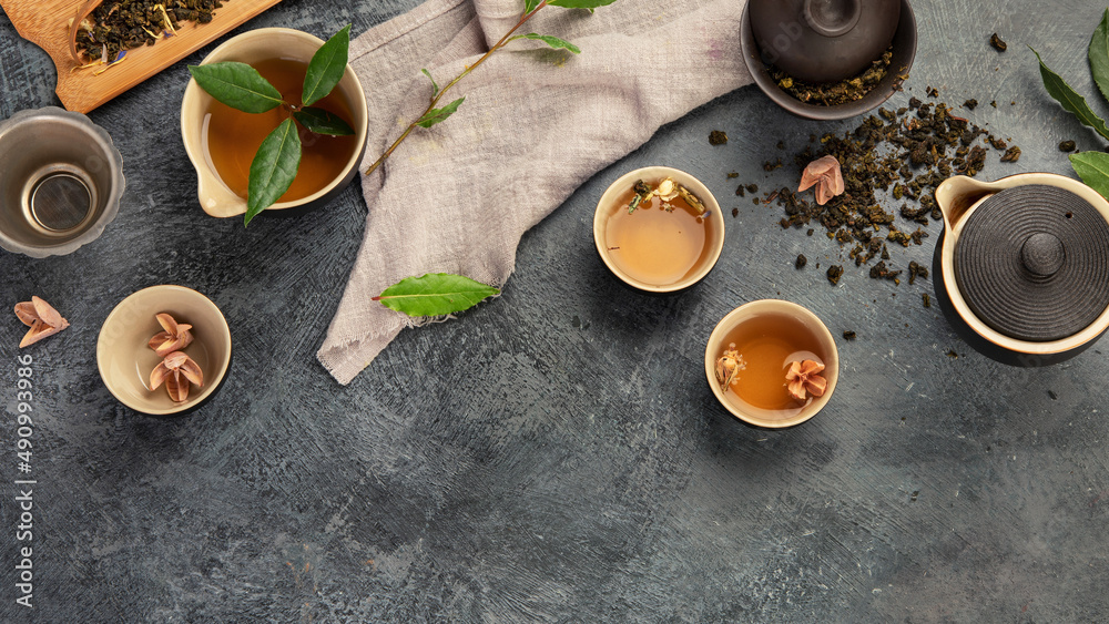 Asian tea set on dark background.