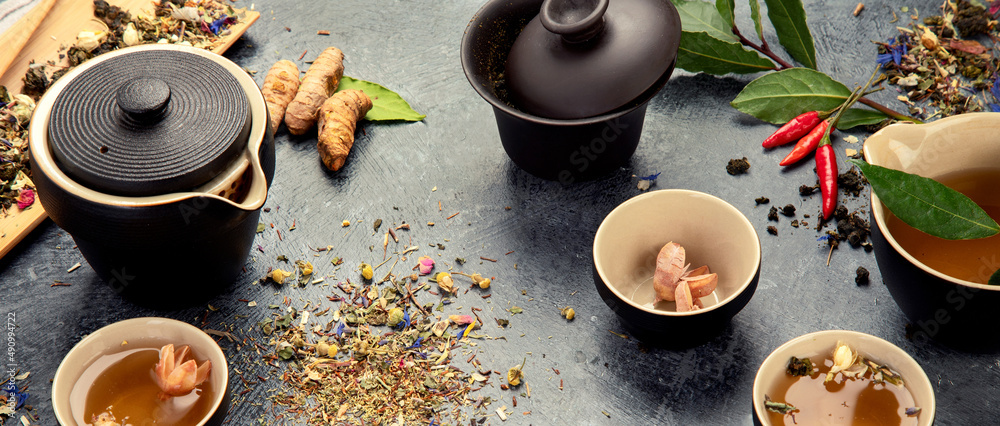 Asian tea set on dark background.