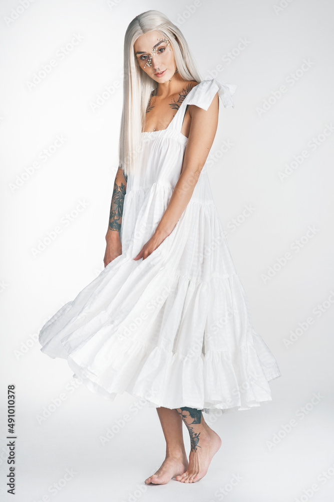 I am beautiful. Full length portrait of an attractive young woman posing against a grey background i