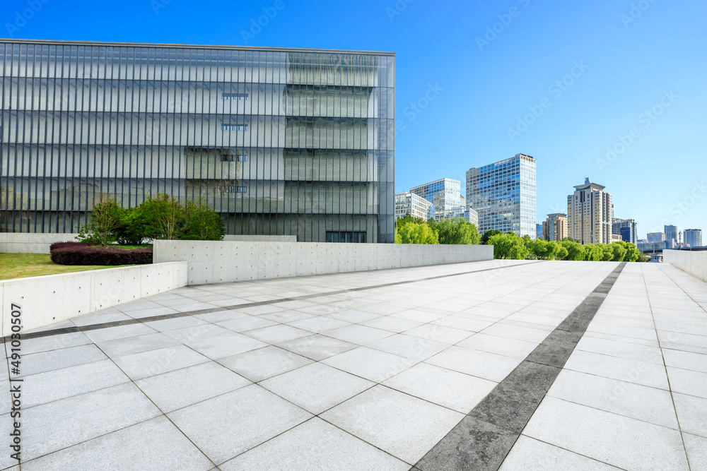 Empty square floor and modern city commercial buildings in Shanghai, China.