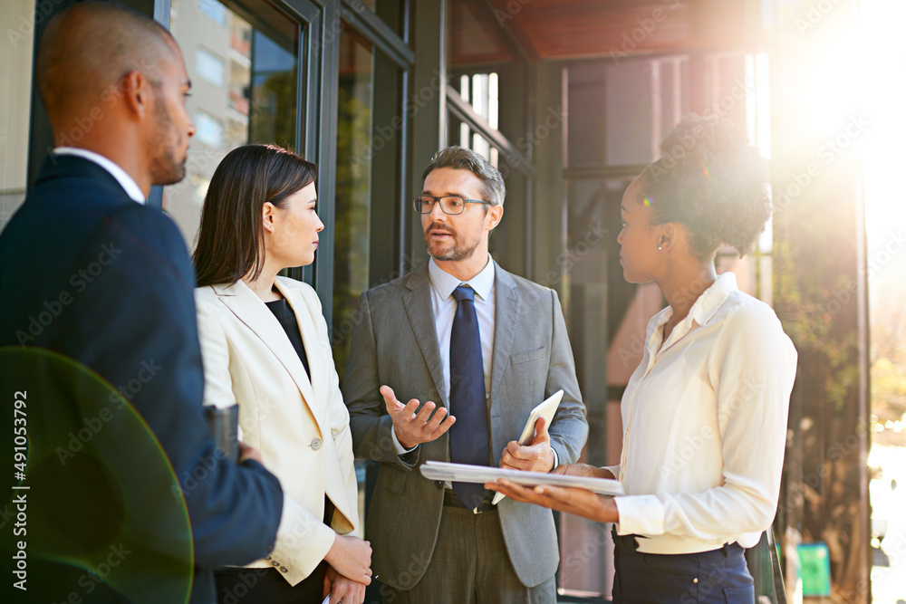 If we work together, well make a success of this. Shot of a diverse group of businesspeople having a