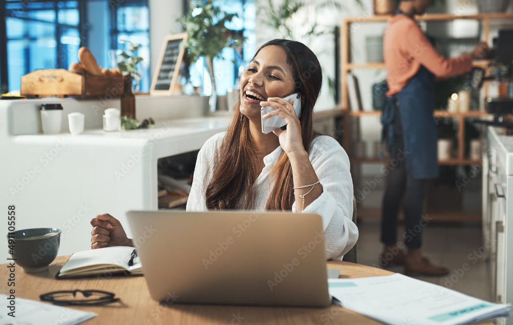 Be the kind of person people love working with. Shot of a businesswoman talking on her cellphone whi