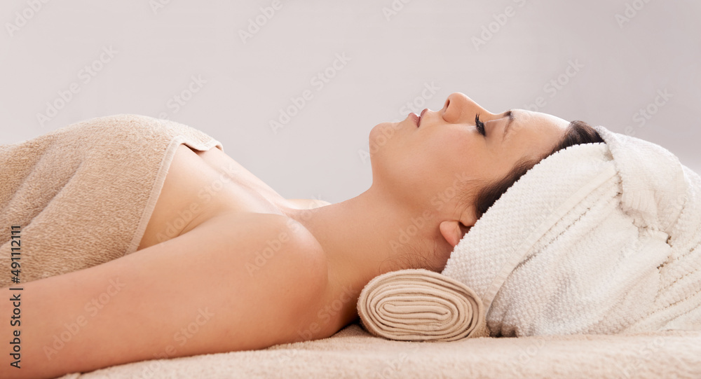 Relaxation and bliss - The perfect spa day. Side view of a gorgeous young woman lying in a day spa.