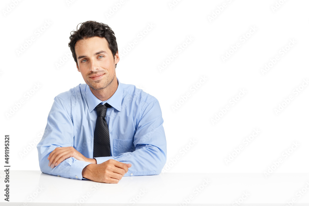 Working with an attitude of positivity. Studio shot of a handsome businessman posing against a white