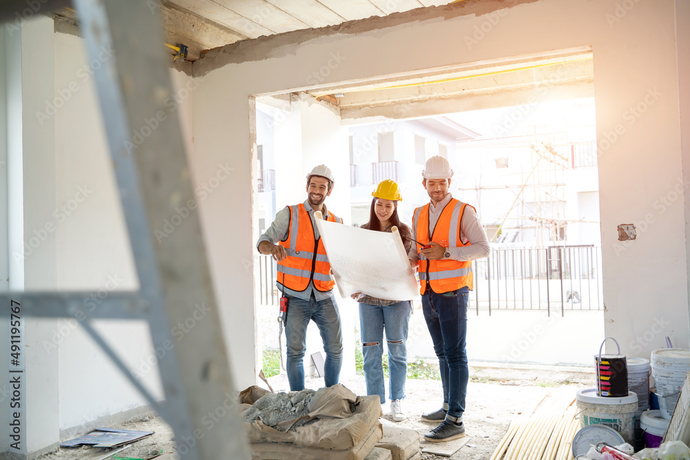 Architect discussing with foreman about project in building construction site,Construction project c