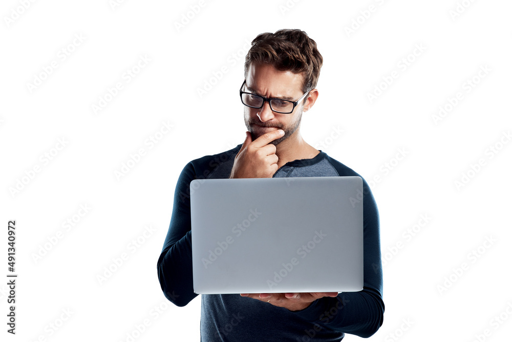 Can you really trust everything on the internet. Studio shot of a handsome young man using a laptop 