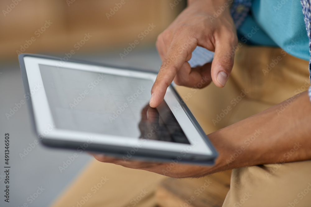 Unlock the world with a touch of your hand. Cropped image of someone working on a digital tablet - c