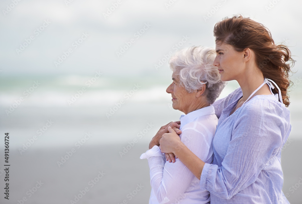 Looking back on their love-filled years together. Shot of a beautiful young woman and her senior mot