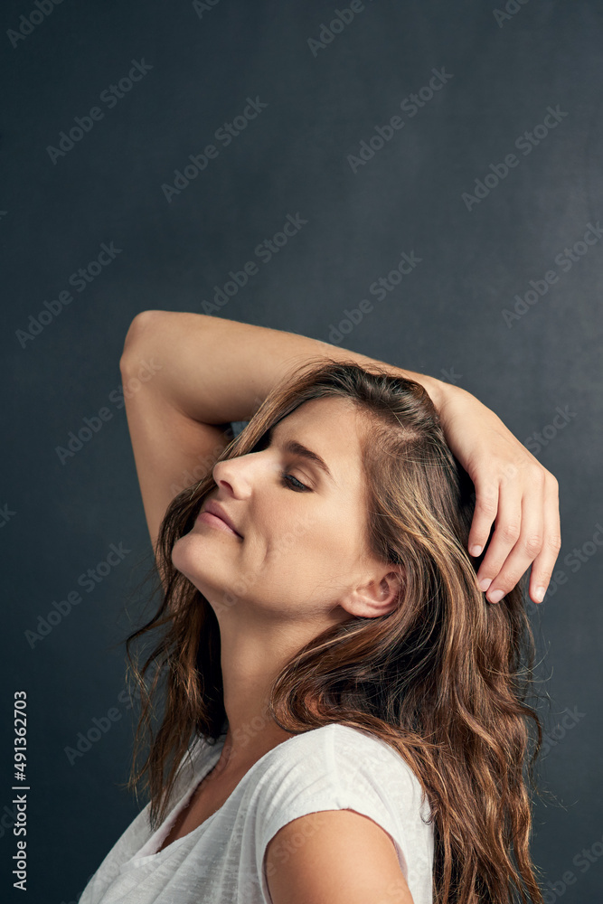 Beautiful and confident. Shot of a beautiful young woman posing in the studio.