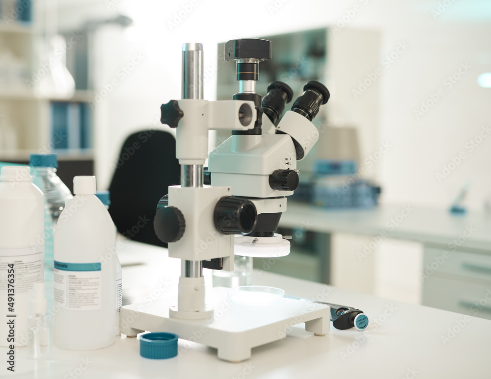 The experiment starts now. Closeup shot of a microscope in a lab.