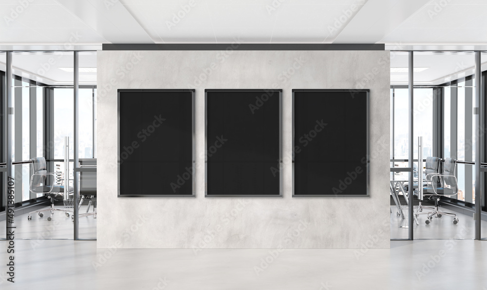 Three vertical frames Mockup hanging on wall. Mock up of billboards in modern concrete office interi