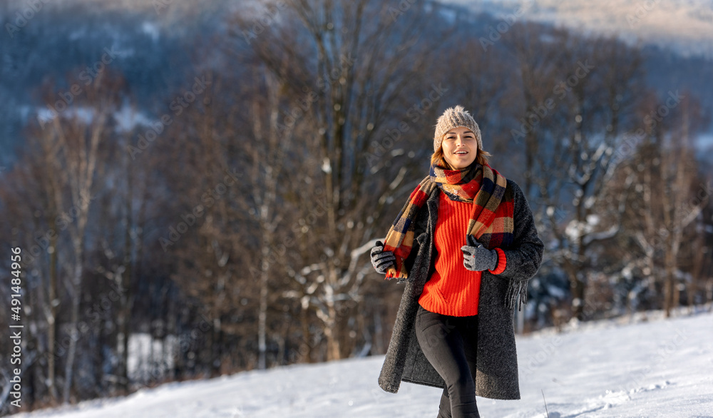 Happy girl in winter clothes portrait snowy outdoor during sunny day