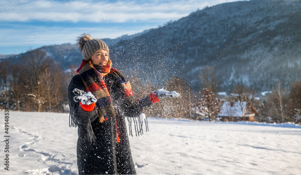 Winter portrait outdoor beautiful woman wearing woolen sweater hat and scarf