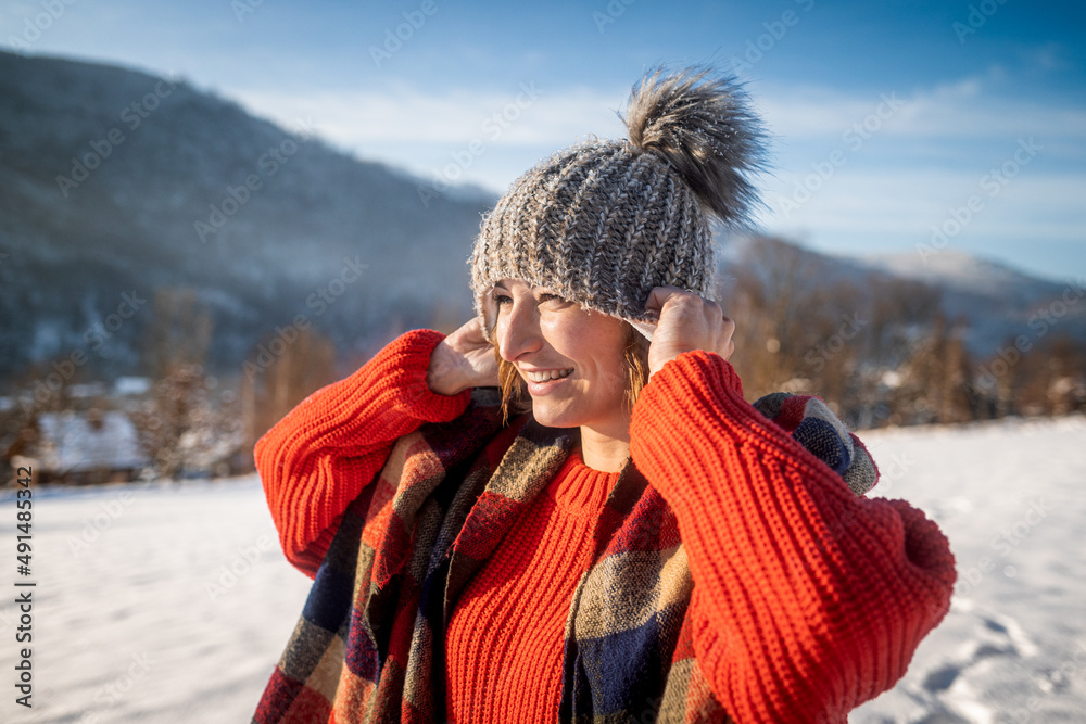 Winter portrait outdoor beautiful woman wearing woolen sweater hat and scarf