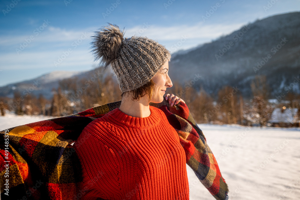 Winter portrait outdoor beautiful woman wearing woolen sweater hat and scarf