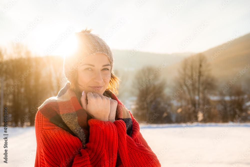 Winter portrait outdoor beautiful woman wearing woolen sweater hat and scarf