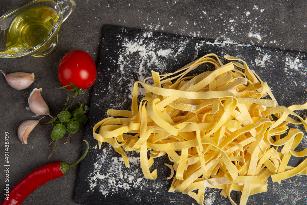 Italian pasta cooking process. Fresh food concept. Home made tagliatelle