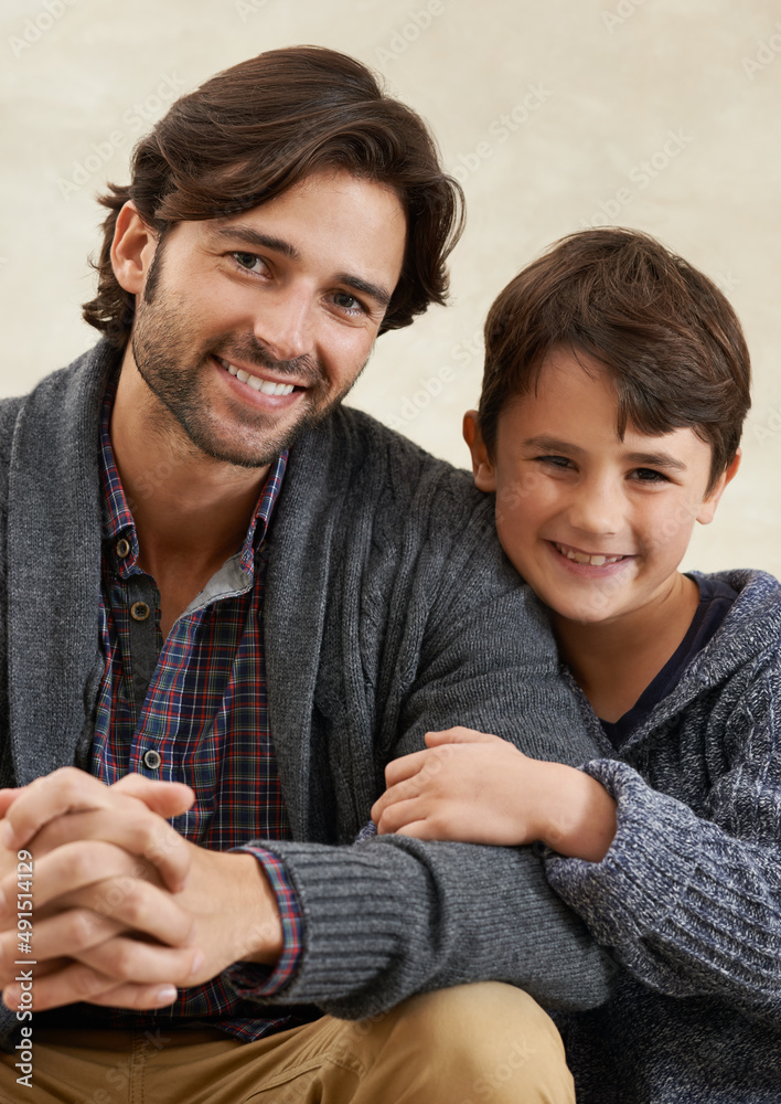 Quality time together. Portrait of a young father and son sitting on the sofa.