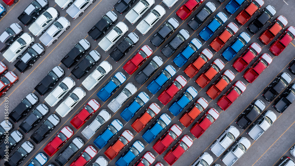 Aerial view new car lined up in the port for import and export business logistic to dealership for s