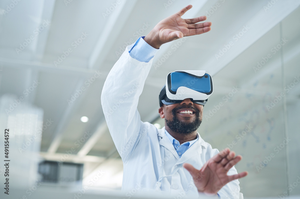 Shaping a whole new world through science. Shot of a mature scientist using a virtual reality headse