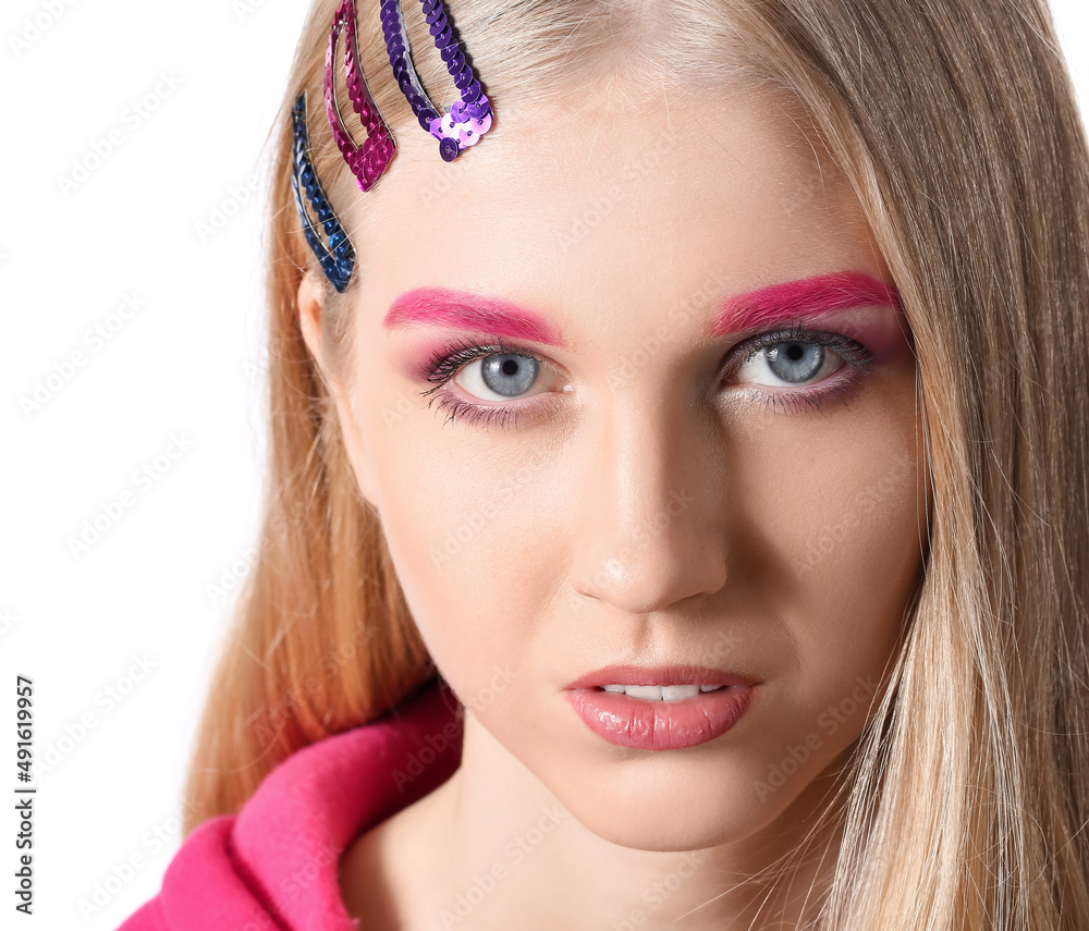 Portrait of woman with stylish hair accessories and creative makeup on white background