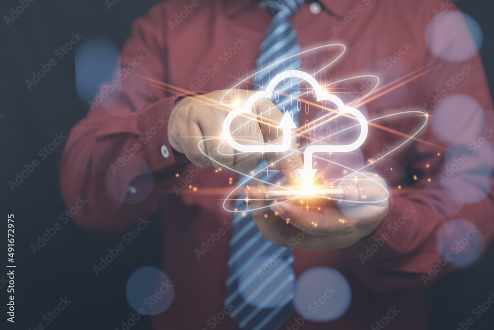 Businessman using to a smartphone with virtual cloud computing to transfer database information uplo