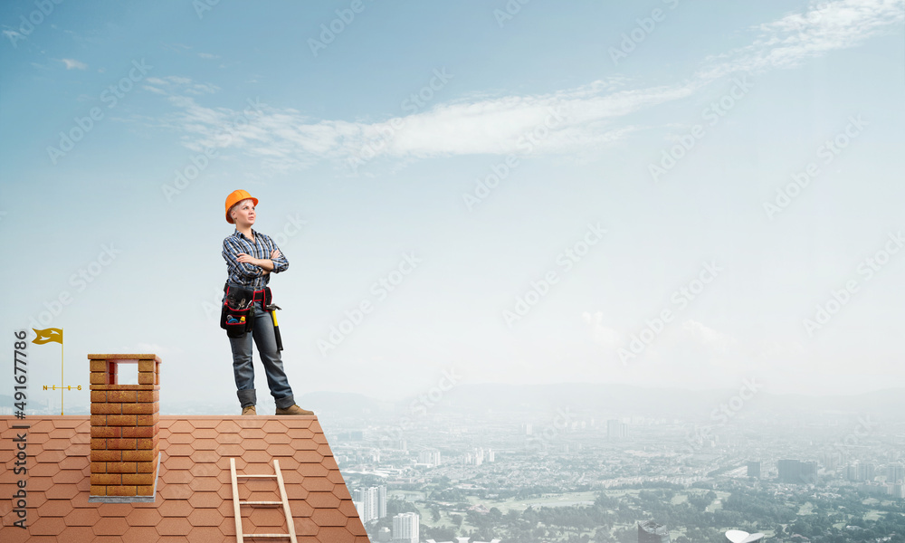 Female construction worker in hardhat standing