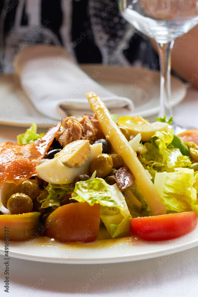 Something healthy and fresh. Closeup of freshly chopped salad on a plate.