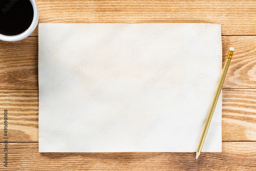 Sheet of paper lying on wooden table