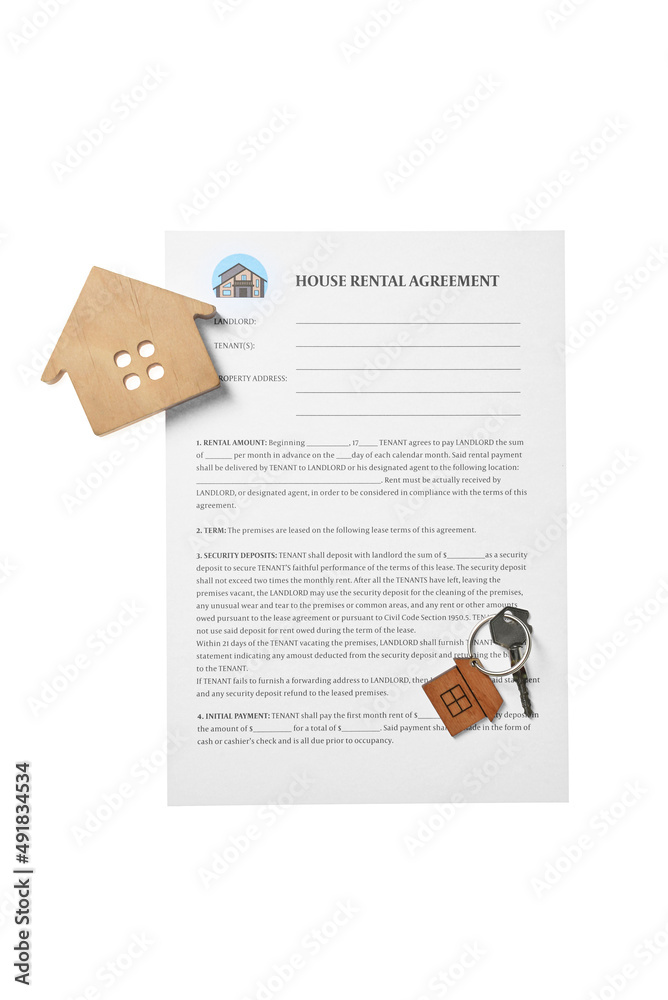 House rental agreement, wooden figure of house and key with keychain on white background