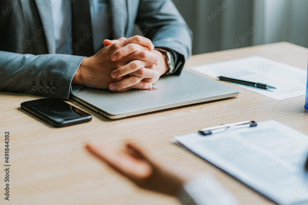 Asian male director is interviewing to recruit new employees