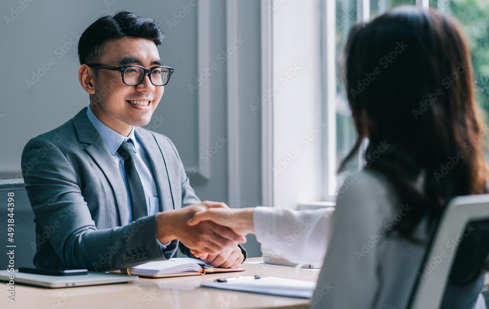 Asian male director is interviewing to recruit new employees